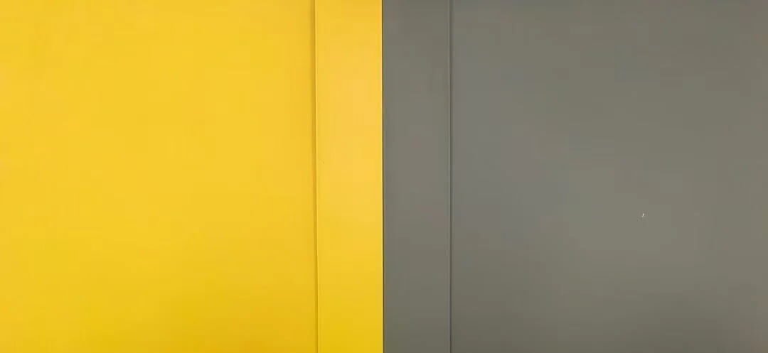 PVC edge banding rolls in multiple Kronospan-matched colors stacked in warehouse