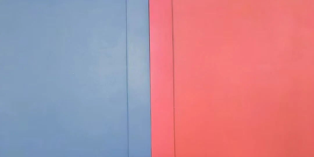Edge banding color-matched to Kronospan panel surface -- close-up showing seamless ΔE ≤ 1.0 match