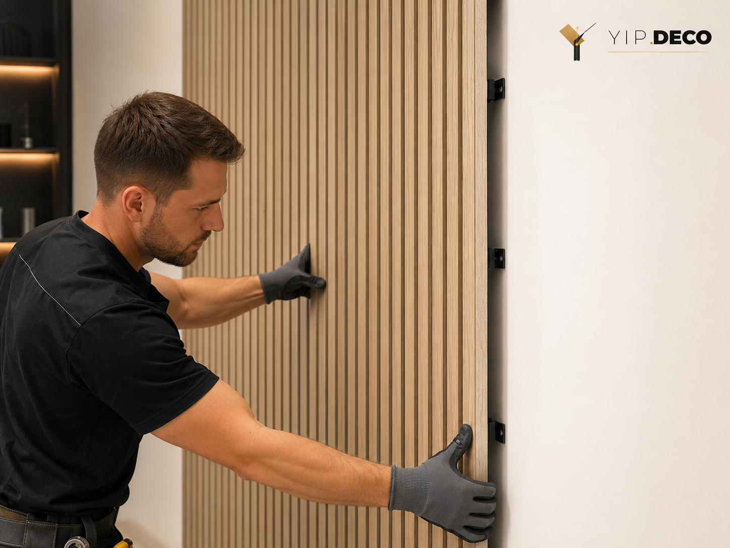 Installer fixing a fluted wall panel directly onto a wall with concealed fixings