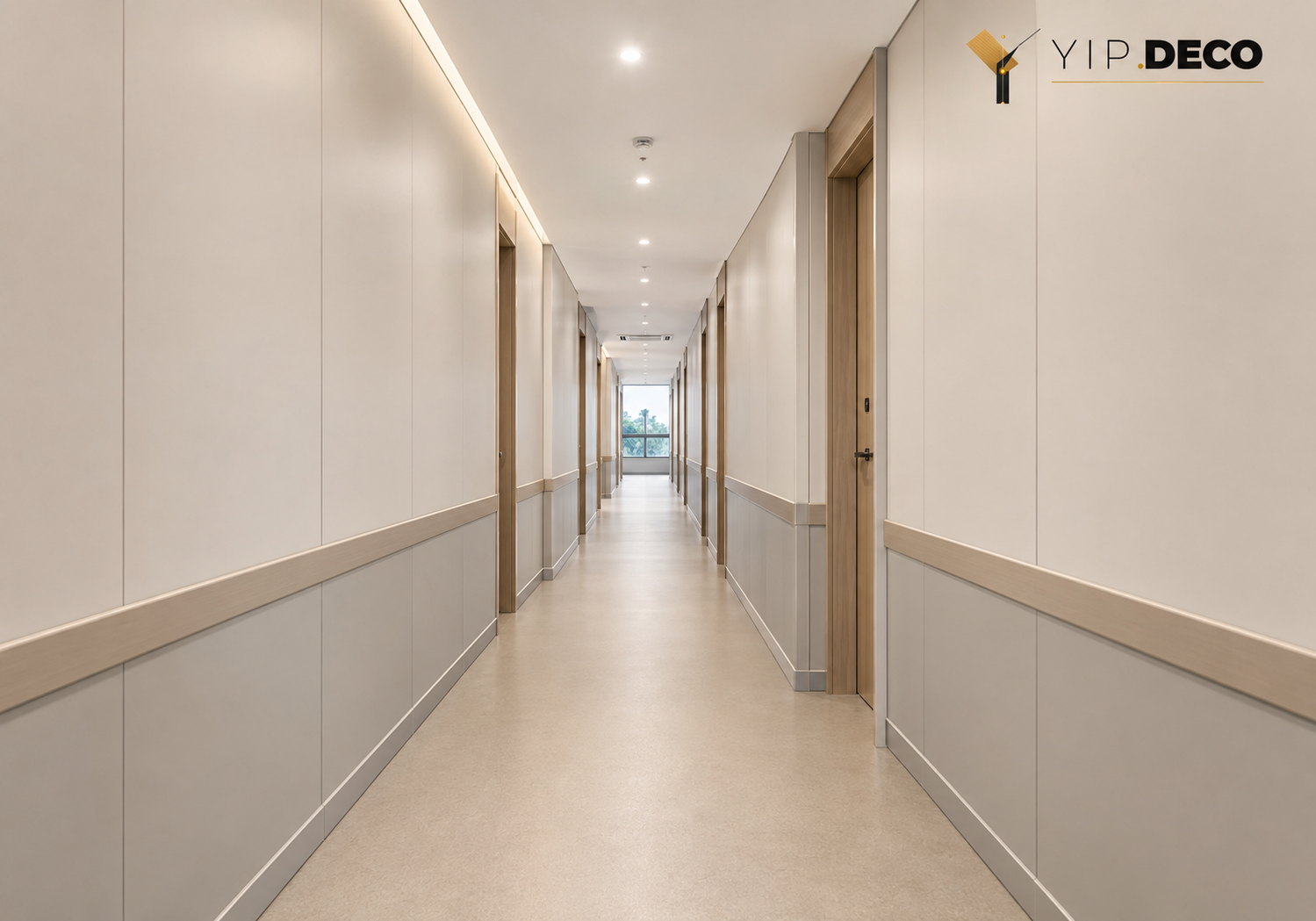 Anti-collision wall panels protecting a hospital corridor wall with corner guards and easy-clean surface