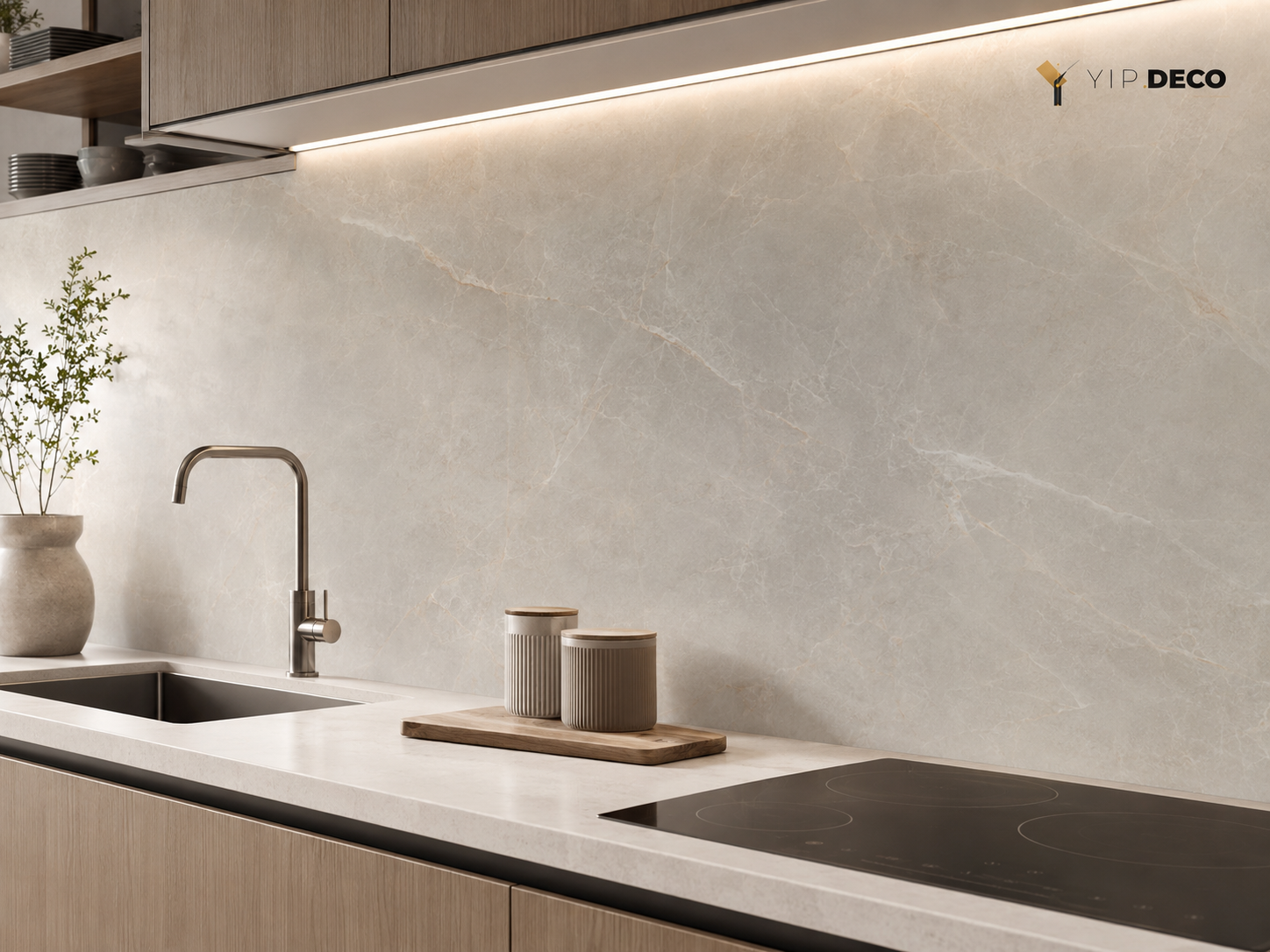 SPC wall panels as a kitchen backsplash with stone-look PET surface behind a modern countertop